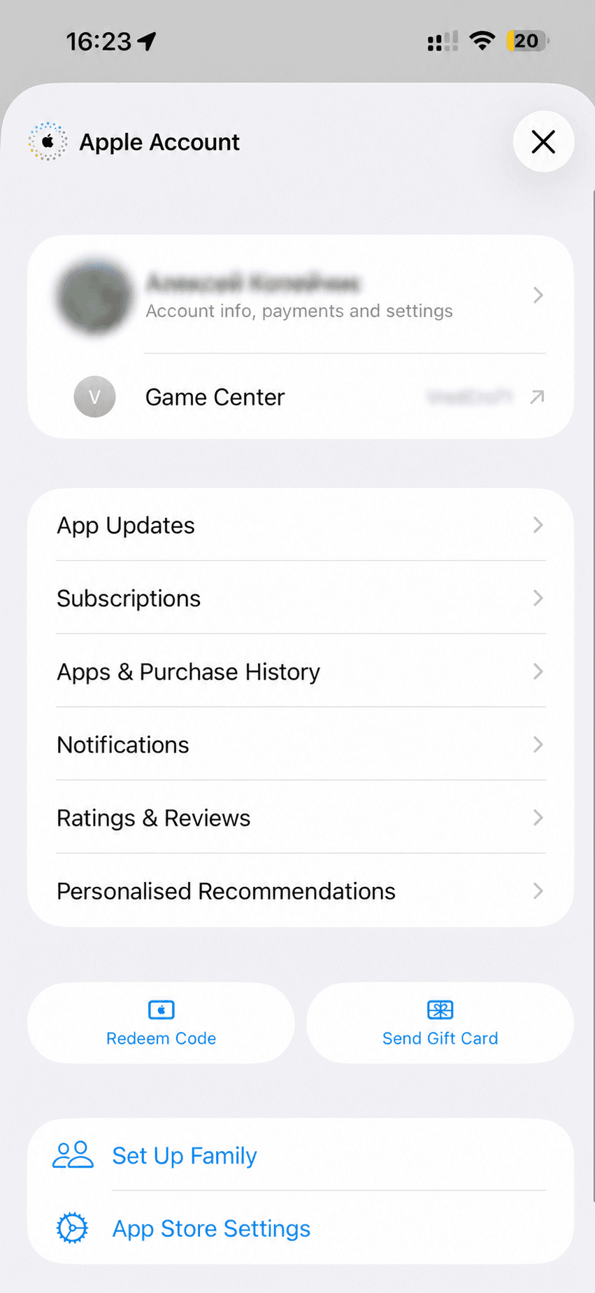 Updated Apple Account screen in iOS 26.4 with the Redeem Code button